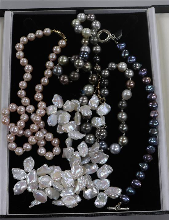 Two cultured pearl necklaces including multi coloured, a cultured pearl bracelet and a baroque pearl necklace.